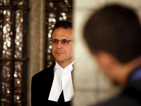 Senate Speaker Leo Housakos waits before a press conference about the auditor general's report on Senate expenses outside the Senate Chamber on Parliament Hill in Ottawa June 9, 2015. REUTERS/Patrick Doyle