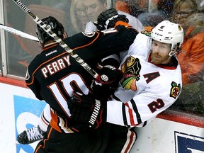 Corey Perry of the Anaheim Ducks slams Duncan Keith of the Chicago Blackhawks into the boards during Game 7 of the Western Conference final at the Honda Center in Anaheim. (Stephen Dunn/Getty Images/AFP)