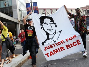 Tadar Muhammad (right) and Jeremy Brustein demonstrate in support of Tamir Rice outside of Quicken Loans Arena prior to Game 3 of the NBA Finals in Cleveland, June 9, 2015. (KEN BLAZE/USA Today)