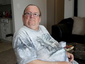 Fred Clarke, who was injured in a March 4 fire at 107 Compton St., sits in the apartment belonging to a relative on Thursday. (Ian MacAlpine/The Whig-Standard)