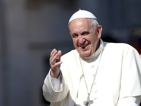 Pope Francis waves as he arrives to lead his Wednesday general audience in Saint Peter's square at the Vatican June 10, 2015. REUTERS/Tony Gentile