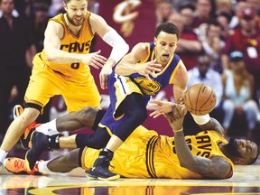 LeBron James’ “slide tackle” on Warriors’ Stephen Curry towards the end of Game 3 was ruled a correct non-call by the NBA. (USA TODAY SPORTS)