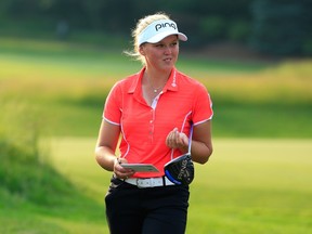 Brooke Henderson smiles as she looks on at the eighth hole during the first round of the KPMG Women's PGA Championship in Harrison, N.Y., on Thursday, June 11, 2015. (Michael Cohen/Getty Images/AFP)