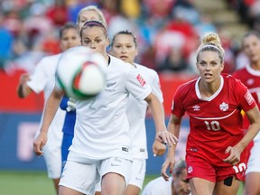 Canada's Lauren Sesselmann (10) and New Zealand's Ria Percival (2) rush for a corner kick during a FIFA Women's World Cup 2015 match at Commonwealth Stadium Thursday. (Ian Kucerak/Edmonton Sun)