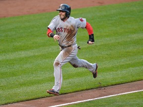Boston Red Sox second baseman Dustin Pedroia scores a run during the fourth inning against the Baltimore Orioles at Oriole Park at Camden Yards on June 11, 2015. (TOMMY GILLIGAN/USA TODAY Sports)