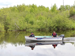 Greater Sudbury Police officers search Wanapitei River in the Wanup area for Gaetanne (Gail) Lynds on Thursday June 11, 2015. Gaetanne's husband, Boyd Lynds, was found dead Wednesday afternoon. The couple was reported missing on Tuesday morning. John Lappa/Sudbury Star/Postmedia Network