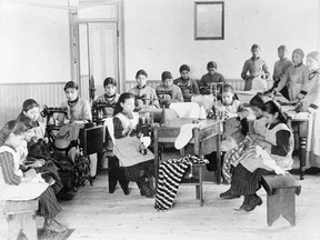 A group of students take part in sewing class at St Joseph's Convent, otherwise known as the Fort Resolution Indian Residential School in Fort Resolution, Northwest Territories in an undated archive photo. 
REUTERS/Canada. Dept. of Mines and Technical Surveys/Library and Archives Canada