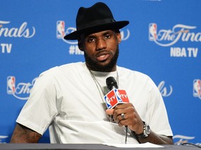 LeBron James of the Cleveland Cavaliers speaks to the media after Game Four of the 2015 NBA Finals against the Golden State Warriors at Quicken Loans Arena on June 11, 2015. (Jason Miller/Getty Images/AFP)