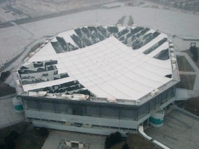 The roof of the Pontiac Silverdome in Pontiac, Michigan that has been visibly damaged by strong winds is pictured in this WWJ Radio aerial photograph released to Reuters on January 23, 2013. (REUTERS/Bill Szumanski/WWJ/Handout)