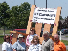 The Ontario Health Coalition set up a large rocking chair near Fairfield Park long-term care facility on June 10, as they're advocating the provincial government to set a minimum care of four hours for hands-on care daily for residents of long-term care facilities.