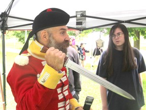 Jake Hodgson, with Broadsword Academy Kingston, demonstrates a fighting technique during the First Capital Day celebration in City Park in Kingston, Ont. on Fri., June 12, 2015. The event marked Kingston's time as capital of a united Canada. Michael Lea/The Whig-Standard/Postmedia Network