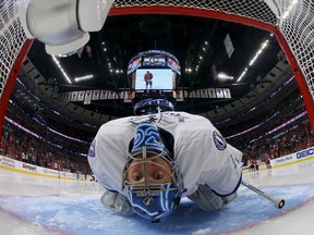 Tampa Bay Lightning goalie Ben Bishop stretches before the second period in Game 3 of the Stanley Cup Final against the Chicago Blackhawks at United Center on June 8, 2015. (Bruce Bennett/Pool Photo via USA TODAY Sports)