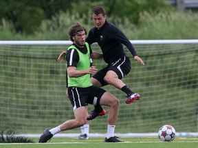 Ottawa Fury FC striker Tommy Heinemann, left, and defender Mason Trafford practice with the club at Carleton University on Thursday, June 11, 2015. (Chris Hofley/Ottawa Sun)