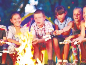 Children enjoy roasting marshmallows at a campfire during summer camp. Thanks to a partnership with the London District Labour Council, Stevenson Children?s Camp continues to offer a summer camp experience to children from low-income families. (Fotolia)