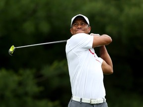 Tiger Woods hits his tee shot on the 17th hole during the third round of The Memorial at Muirfield Village Golf Club on June 6, 2015 in Dublin, Ohio. (Andy Lyons/Getty Images/AFP)
