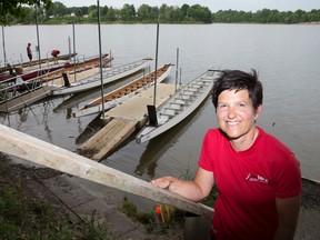 Breast cancer survivor and organizer of the Fanshawe Dragon Boat Festival Linda Kuska stands near the boats being used at the races this coming weekend, before a training session at the Fanshawe Yacht Club at Fanshawe Lake in London, Ont. on Thursday June 11, 2015. Craig Glover/The London Free Press/Postmedia Network