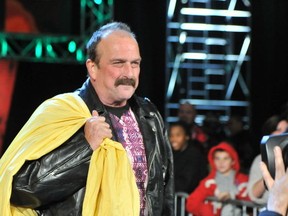 Jake The Snake Roberts walks down the ramp toward the ring during his surprise return to World Wrestling Entertainment in 2014. Roberts will bring his Unspoken Word tour to eastern Ontario in August, including a stop in Kingston on Aug. ​8. Supplied photo