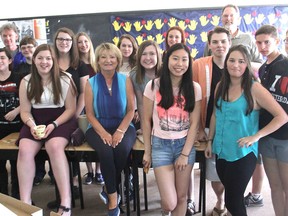 Some of the students and staff, including teacher Francine Leblanc, centre, who had gone on a trip to Europe recently gathered at their high school in Napanee, Ont. on Thurs., June 11, 2015, to discuss their experiences. Michael Lea/The Whig-Standard/Postmedia Network