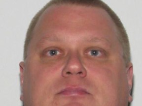 Norman Raddatz, 42, was wanted for criminal harassment of a local family. When police came to the door to arrest him, Raddatz unleashed over 50 bullets before a fire was ignited burning the house to the ground. Const. Daniel Woodall, 35, a hate crimes officer, was killed in the hail of bullets. (Police handout photo)