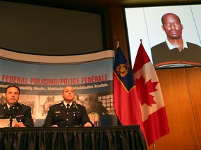 RCMP Assistant Commissioner James Malizia and Insp. Paul Mellon address the media at a press conference on Friday June 12, 2015. The RCMP have arrested Ali Omar Ader in the alleged hostage taking of Canadian freelance journalist Amanda Lindhout in 2008-2009.  
Tony Caldwell/Ottawa Sun