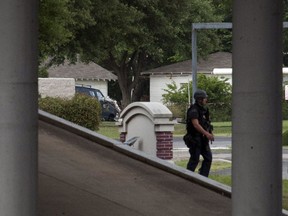 An armoured van can be seen in the city of Hutchins, south of Dallas, Texas on June 13, 2015. Shots were fired from the van in an attack on Dallas Police headquarters early on Saturday, police said, and an explosive device was later found outside the building. (REUTERS/Rex Curry)