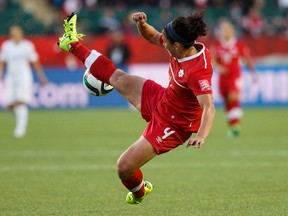 Canada's Carmelina Moscato kicks a ball in the air during a FIFA Women's World Cup match against New Zealand at Commonwealth Stadium on June 11, 2015. (Ian Kucerak/Edmonton Sun/Postmedia Network)