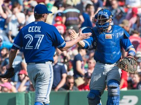 Toronto Blue Jays pitcher Brett Cecil and catcher Russell Martin celebrate the 5-4 victory against the Boston Red Sox at Fenway Park on June 13, 2015. (Gregory J. Fisher/USA TODAY Sports)