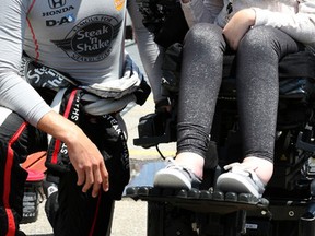 IndyCar driver Graham Rahal of Rahal Letterman Lanigan Racing meets Tori Lacey in support of FightSMA on June 13, 2015. (Veronica Henri/Toronto Sun)