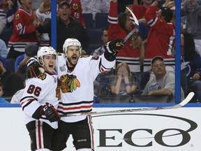 Chicago Blackhawks centre Antoine Vermette, right, celebrates with Teuvo Teravainen after scoring a goal against the Tampa Bay Lightning in the third period of Game 5 of the 2015 Stanley Cup final at Amalie Arena. (Kim Klement-USA TODAY)