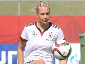 German midfielder Lena Goessling kicks the  ball during FIFA soccer practice in Winnipeg, Man. Saturday June 13, 2015.