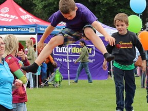 Braden Webb, 9, leaps off a trampoline at a Bluewater Gymnastics display at Kids Funfest Saturday. The 20th annual free festival featured all sorts of activities and attractions for kids. (Tyler Kula/Sarnia Observer/Postmedia Network)