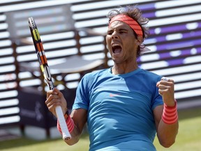 Spain's Rafael Nadal reacts after defeating Serbia's Viktor Troicki in the final match at the ATP Mercedes Cup tennis tournament in Stuttgart, Germany, on June 14, 2015. (AFP PHOTO/THOMAS KIENZLE)