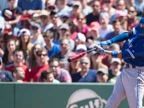 Toronto Blue Jays second baseman Ryan Goins hits a three-run home run during the fourth inning against the Boston Red Sox at Fenway Park on June 14, 2015. (Gregory J. Fisher/USA TODAY Sports)