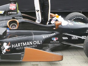 Josef Newgarden stands in his car and celebrates after winning the Honday Indy Toronto on Sunday. (DAVE ABEL, Toronto Sun)