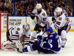 Cedric Paquette of the Tampa Bay Lightning crashes into the net against Corey Crawford of the Chicago Blackhawks during Game 5 of the 2015 Stanley Cup Final at Amalie Arena on June 13, 2015. (Scott Iskowitz/Getty Images/AFP)