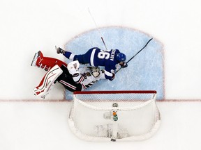 Tampa Bay Lightning right winger Nikita Kucherov collides with Chicago Blackhawks goalie Corey Crawford in the first period in Game 5 of the Stanley Cup Final at Amalie Arena on June 13, 2015. (Reinhold Matay/USA TODAY Sports)