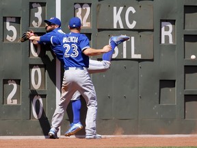 Blue Jays Danny Valencia and Kevin Pillar can't get to a Pablo Sandoval triple during the fifth inning at Fenway Park in Boston on Sunday. (Getty Images/AFP)