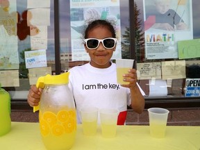 John Lappa/The Sudbury Star
Grace Kalu, 7, serves lemonade at the Eye Level Learning Center fundraiser for NEO Kids on Saturday.