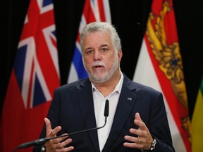 Quebec Premier Philippe Couillard speaks to the media during their Council of the Federation summit in Charlottetown, P.E.I., in this Aug. 28, 2014 file photo. (REUTERS/Christinne Muschi)