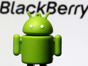 An Android mascot is seen in front of a logo of Blackberry in this photo illustration taken in Zenica, Bosnia and Herzegovina, June 12, 2015. REUTERS/Dado Ruvic