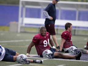 Michael Sam, the newly signed defensive end for the Montreal Alouettes CFL football team, stretches during rookie training camp in Sherbrooke, Quebec May 27, 2015. (REUTERS/Christinne Muschi)