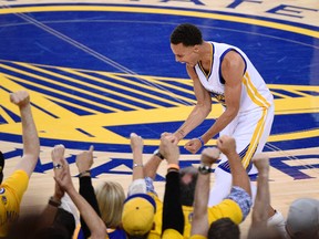 Golden State Warriors guard Stephen Curry reacts during the fourth quarter against the Cleveland Cavaliers in Game 5 of the NBA Finals at Oracle Arena on June 14, 2015. (Kyle Terada/USA TODAY Sports)