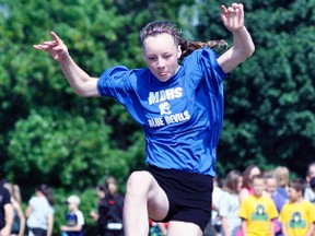 Grade 7 student Madalyn Emery of MDHS leaps high into the pit during the intermediate girls long jump event. She finished third overall. ANDY BADER/MITCHELL ADVOCATE