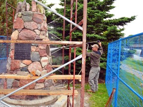 Robin Gilholm of Gilholm Stoneworks Ltd. completes some final pressure washing of the Cairn that once stood at the corner of Ontario Road and St. George Street in Mitchell. Gilholm and his crew moved the cairn to Centennial Park – close to the dam - in preparation for the Streetscape project to begin. GALEN SIMMONS/MITCHELL ADVOCATE