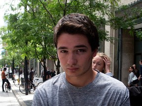 Mitchell Irwin, 19, of Keswick, leaves College Park courts after being released on bail on Monday June 15, 2015. (Dave Abel/Toronto Sun)