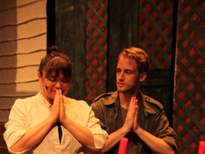 Renee DeSilva as Kim and Brian Christensen as Chris in Miss Saigon. Photo by Tim Ho