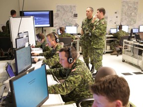 Canadian army officers work on a simulated battle exercise at Canadian Forces Base Kingston in Kingston on Monday. (Elliot Ferguson/The Whig-Standard)