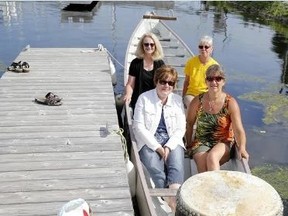 Emily Mountney-Lessard/The Intelligencer
Belleville Dragon Boat Club members Diane Helman and Mary Olsen in back, with club commodore Manon MacFarlane (front, right) are shown here with Jennifer Loner of Three Oaks Shelter and Services, at Victoria Park, on Monday in Belleville.