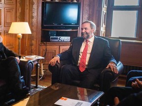 NDP Leader Thomas Mulcair meets with Bono in Ottawa, June 15, 2015, in this handout photo provided by the Office of Thomas Mulcair. REUTERS/Office of Thomas Mulcair/Handout via Reuters
