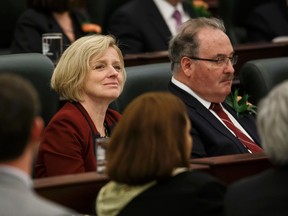 Premier Rachel Notley (left) and Minister of Infrastructure and Minister of Transportation Brian Mason are seen during the Speech From The Throne read on the floor of the Alberta Legislature by Lt.-Gov. Lois Mitchell in Edmonton, Alta., on Monday June 15, 2015. The Speech From The Throne marks the beginning of the 29th Legislature. Ian Kucerak/Edmonton Sun